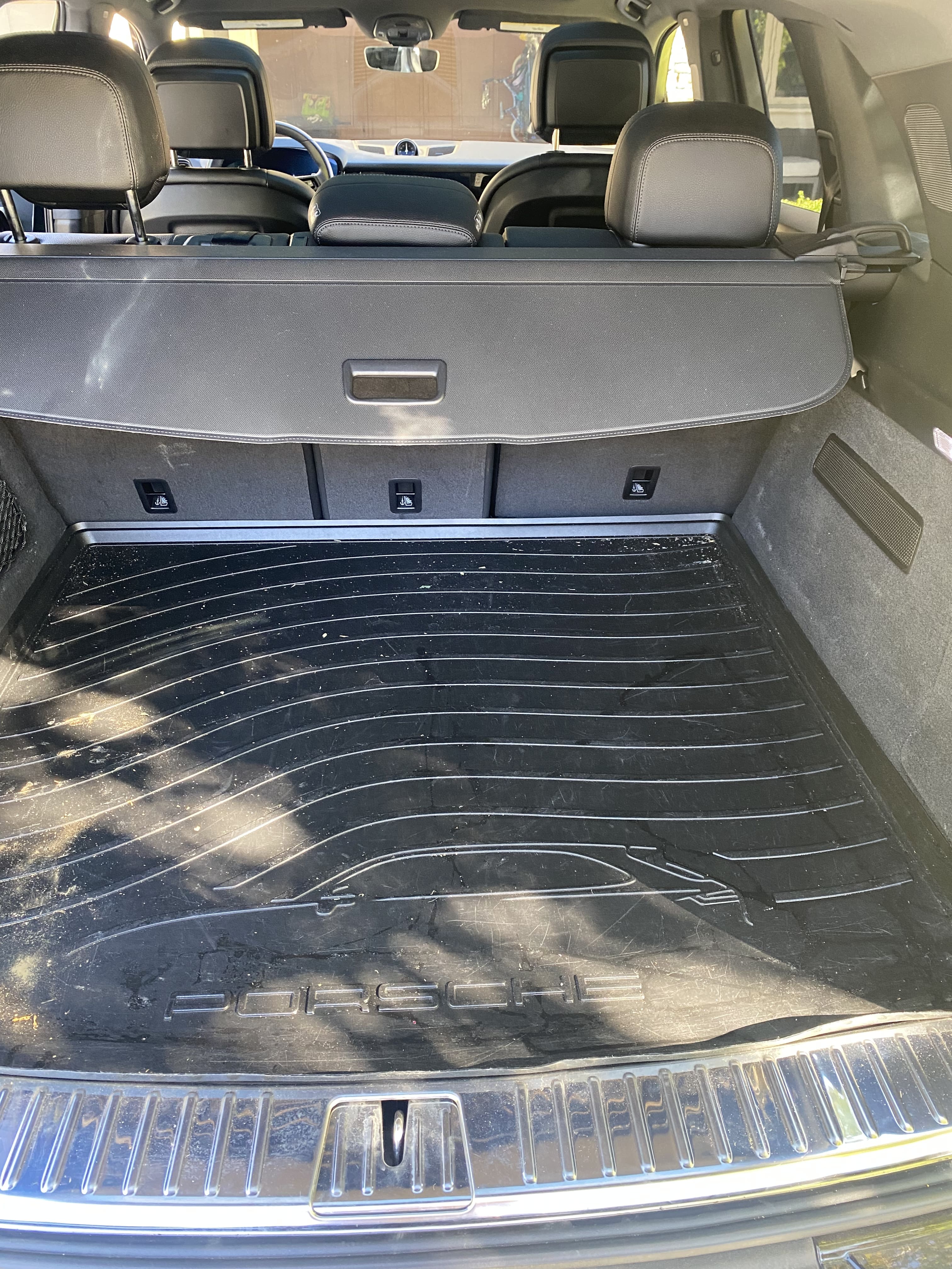 Porsche Cayenne trunk before detailing with visible dust and debris